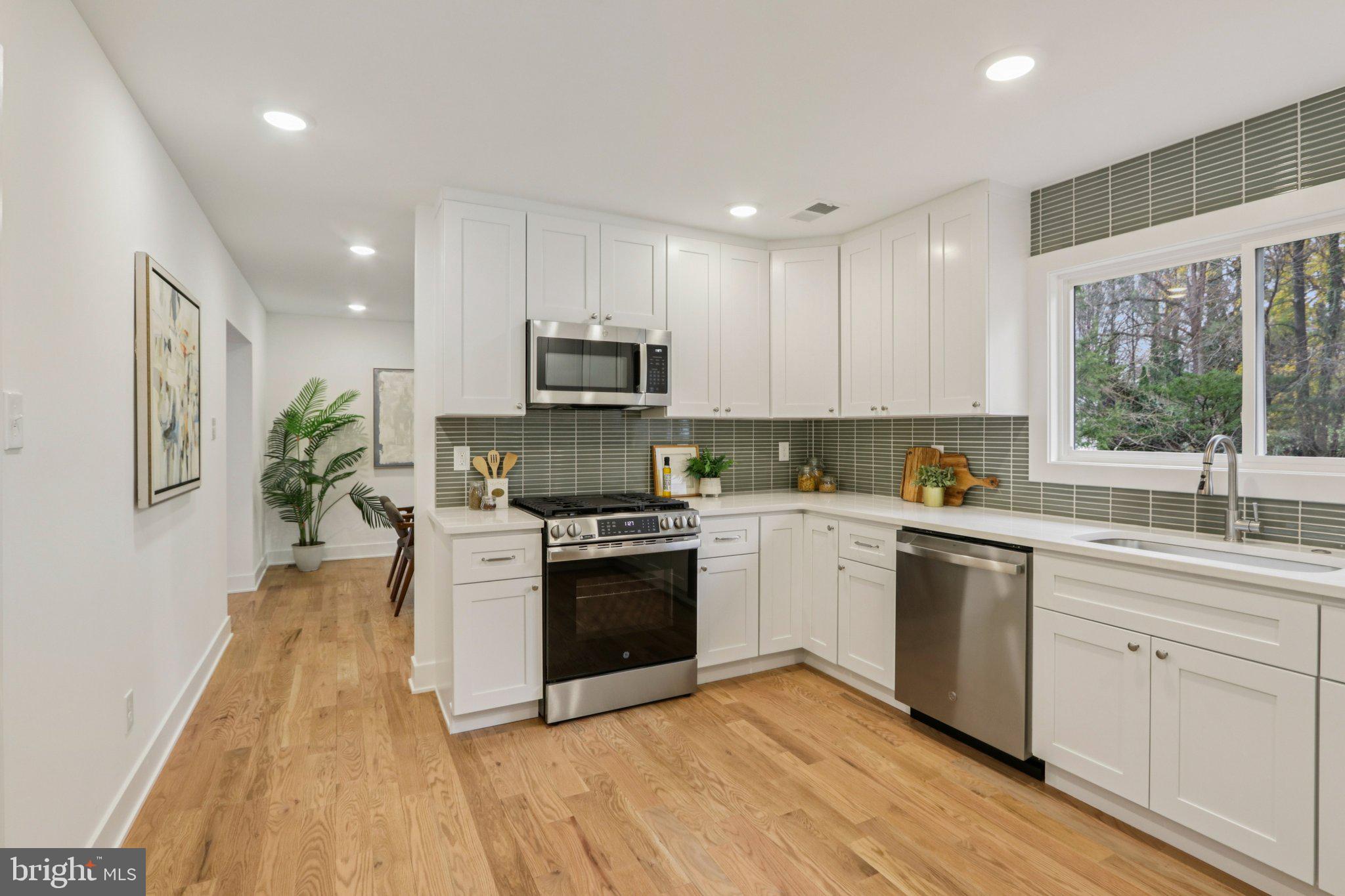 3004 North Wales Road Norristown, PA 19403 - Photo 18 of 44 a kitchen with a white stove top oven and white cabinets