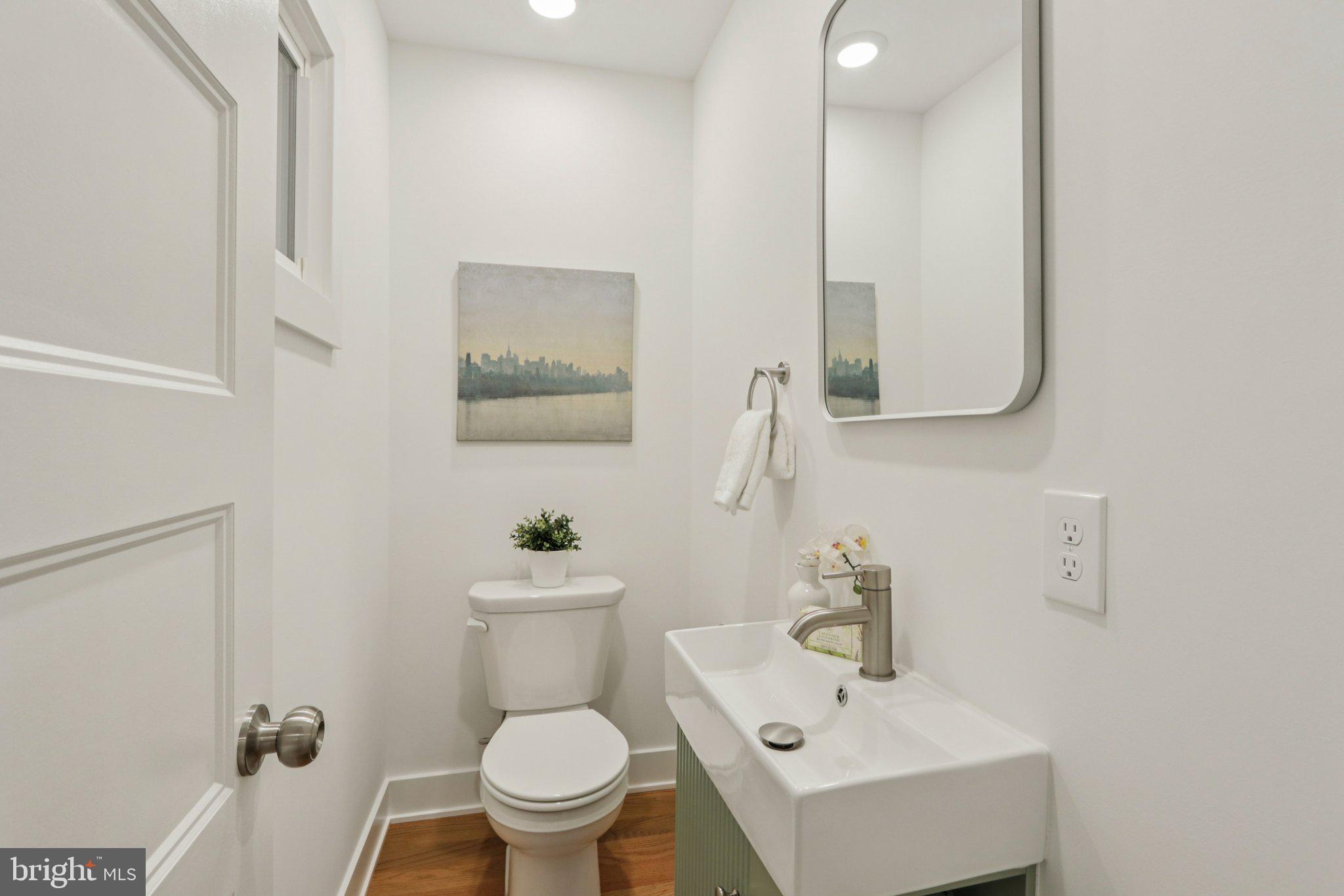 3004 North Wales Road Norristown, PA 19403 - Photo 20 of 44 a bathroom with a sink mirror and toilet