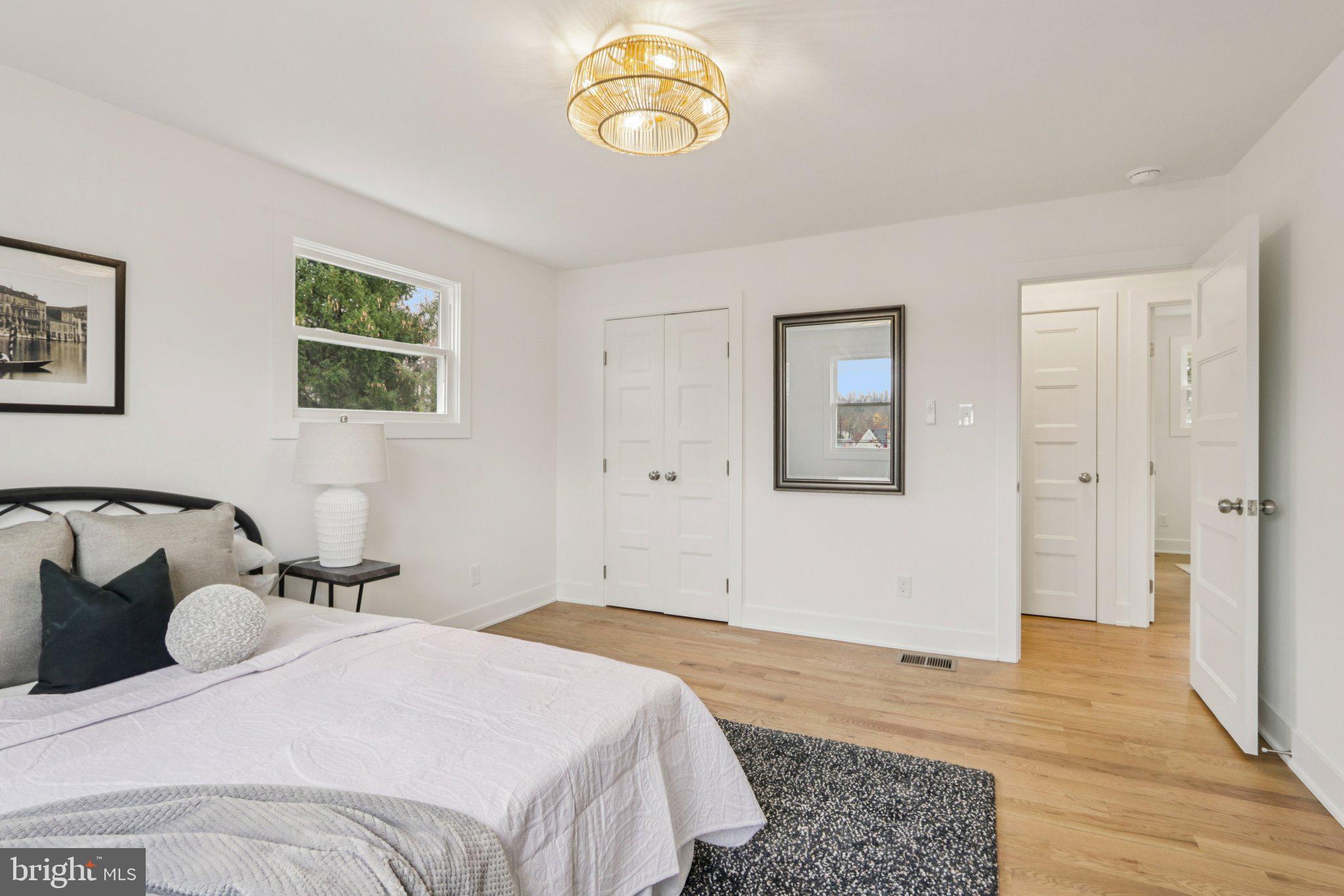 3004 North Wales Road Norristown, PA 19403 - Photo 30 of 44 a bedroom with a bed and wooden floor