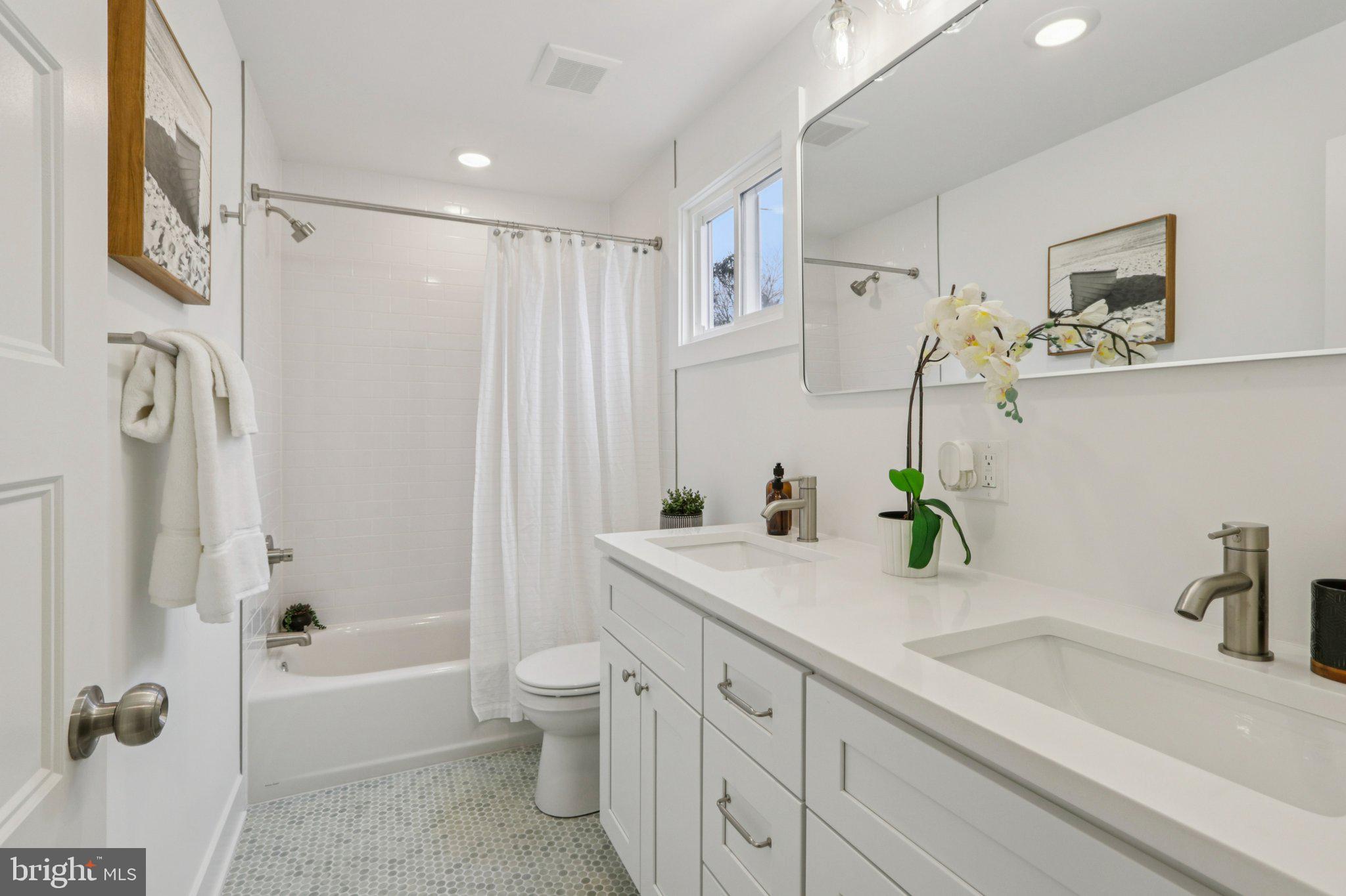 3004 North Wales Road Norristown, PA 19403 - Photo 31 of 44 a bathroom with a granite countertop sink a toilet and shower