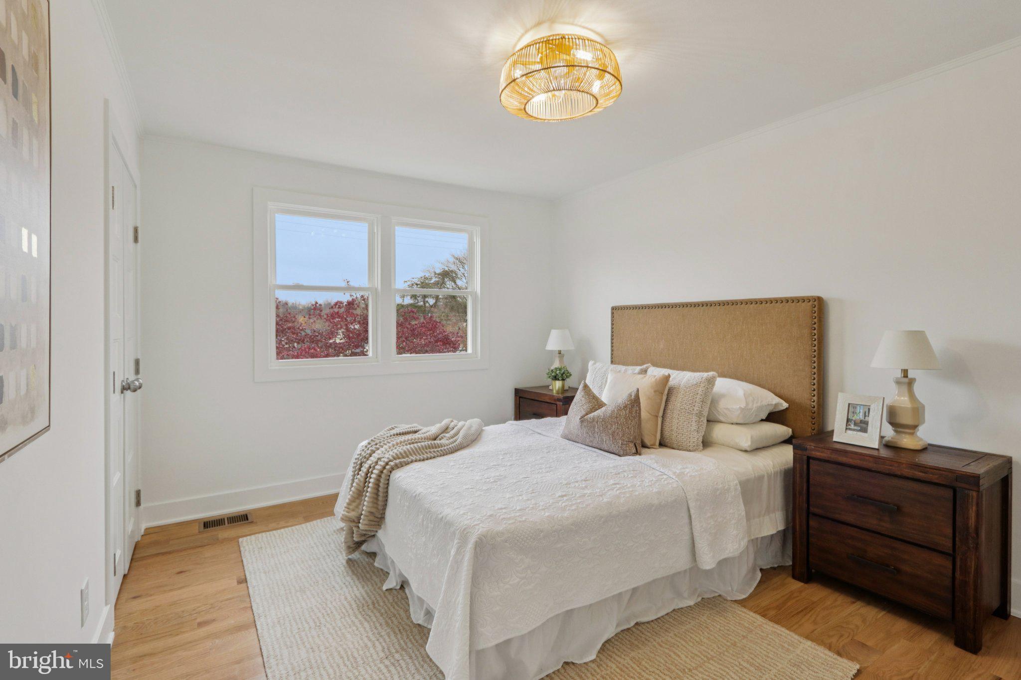 3004 North Wales Road Norristown, PA 19403 - Photo 32 of 44 a bedroom with a bed and a lamp on dresser