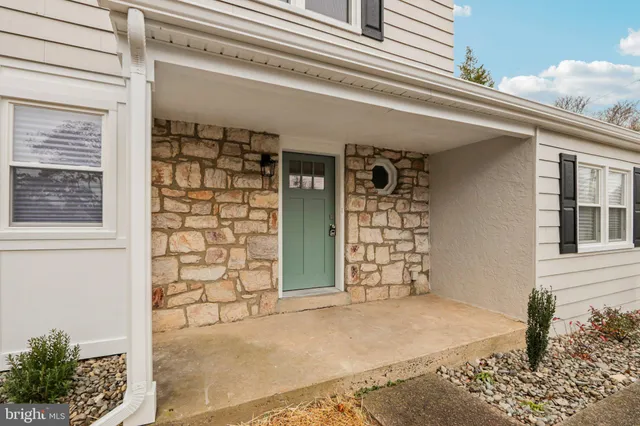a view of entryway with wooden floor and stairs