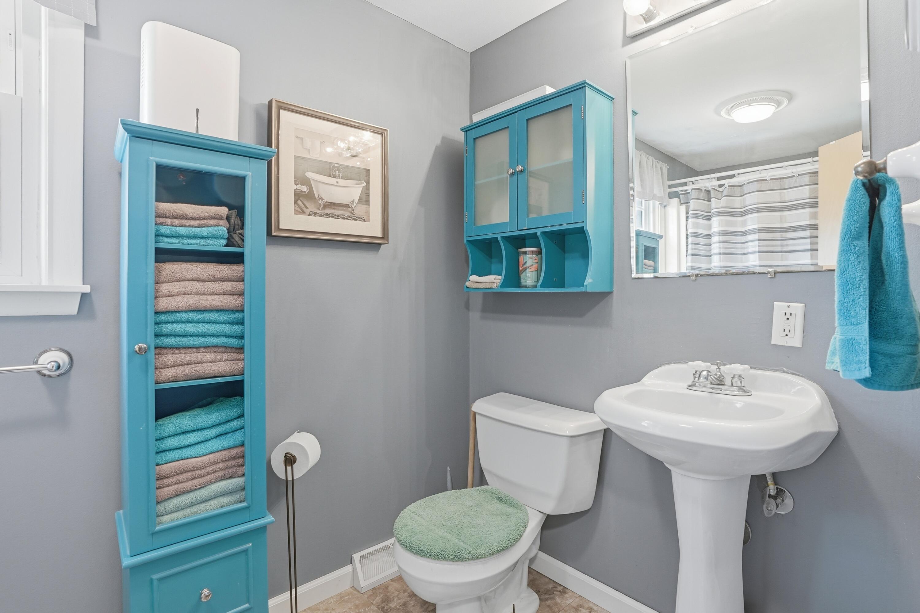 8951 State Line Road Dyer, IN 46311 - Photo 15 of 28 a bathroom with a sink toilet and a mirror