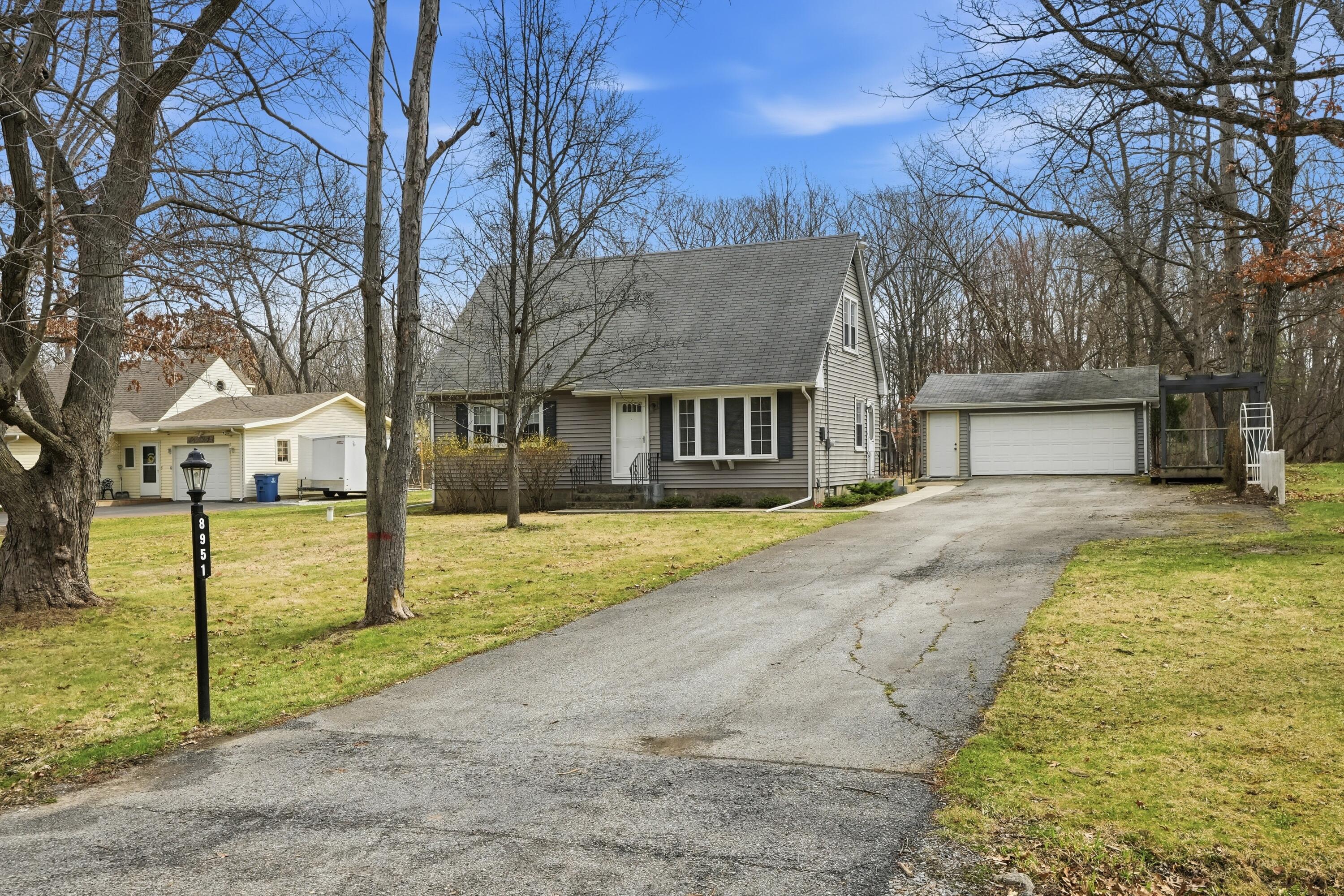 8951 State Line Road Dyer, IN 46311 - Photo 2 of 28 a front view of a house with a yard