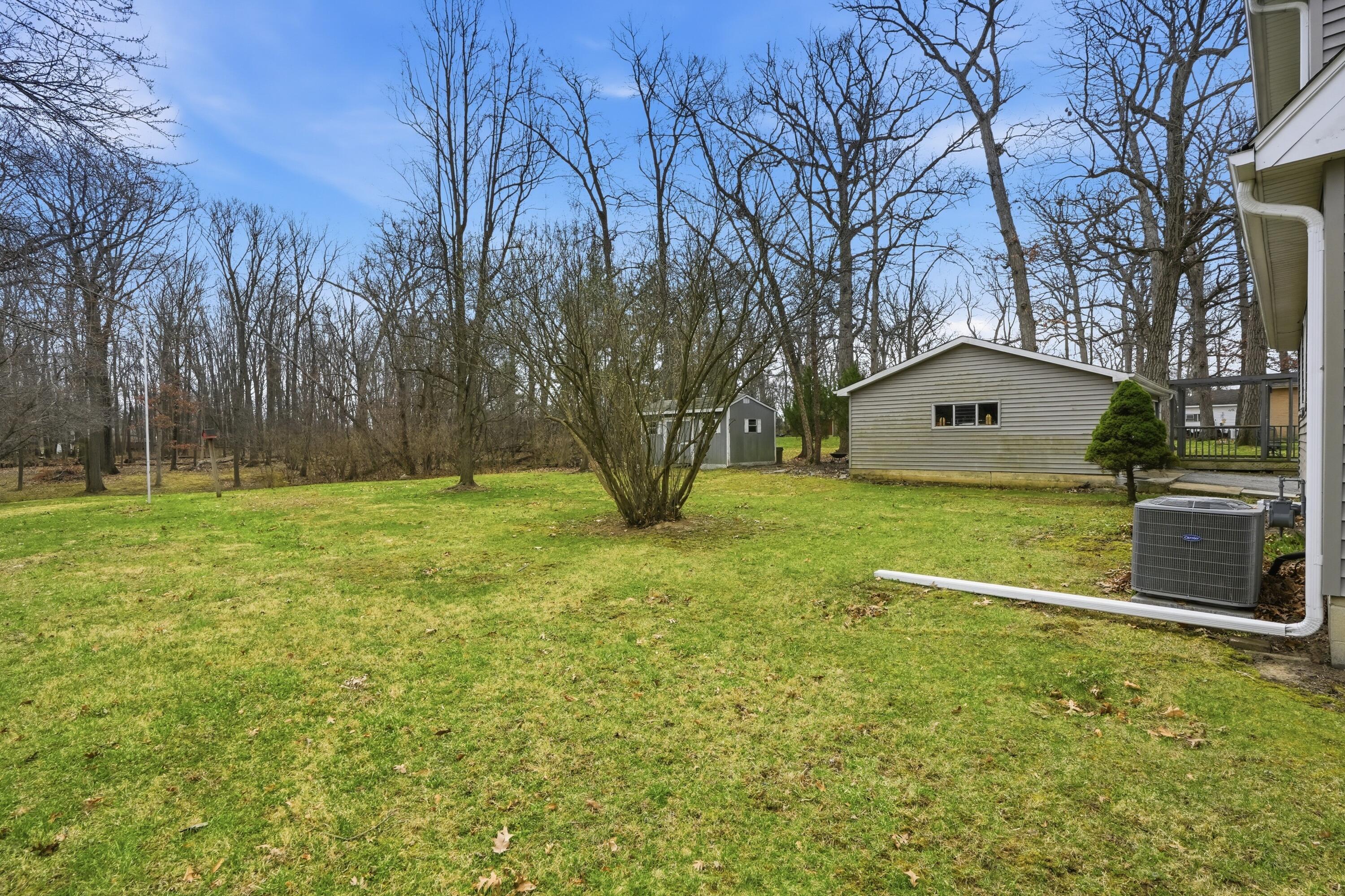 8951 State Line Road Dyer, IN 46311 - Photo 23 of 28 a backyard of a house with lots of green space