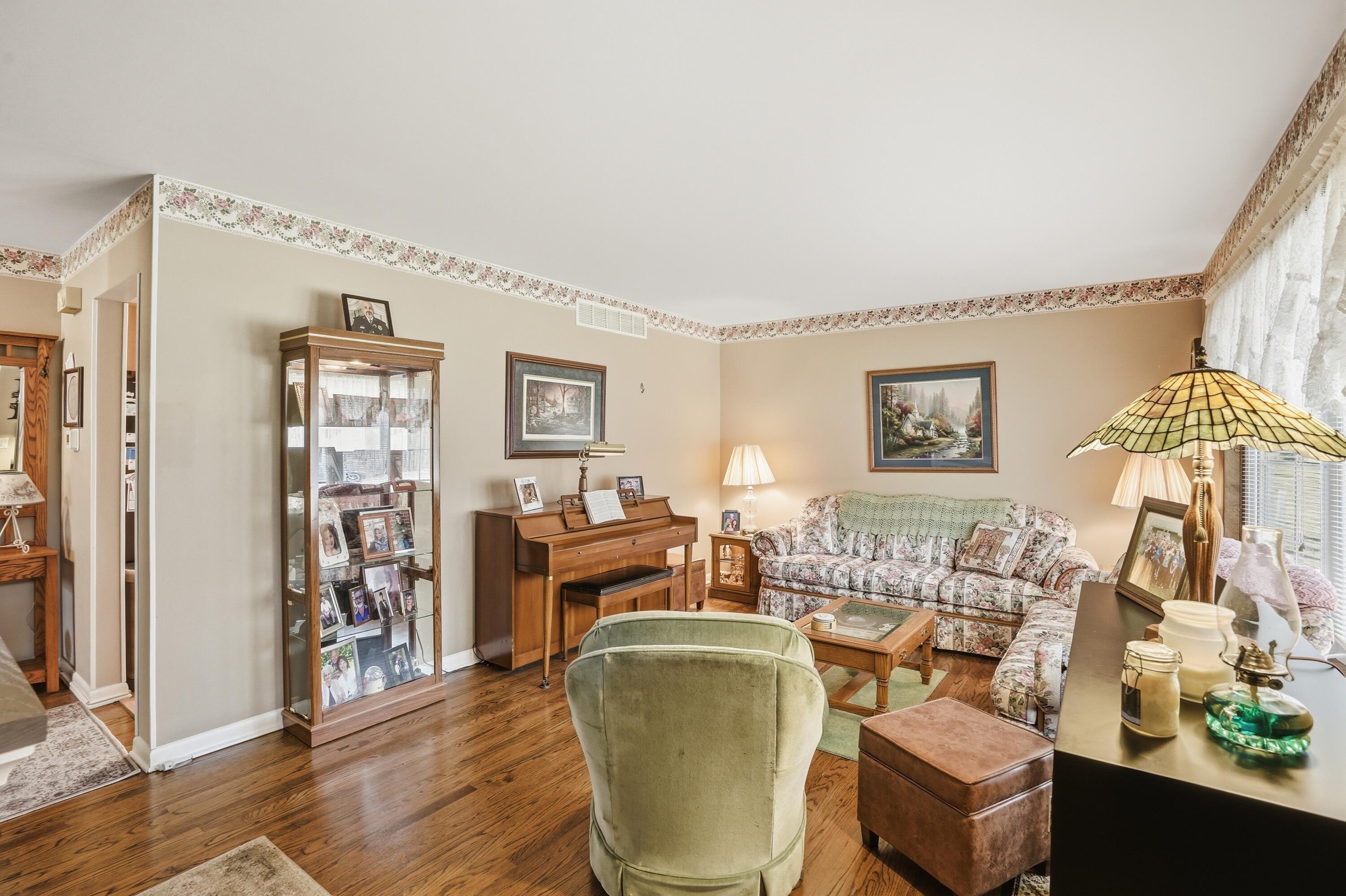 8951 State Line Road Dyer, IN 46311 - Photo 5 of 28 a living room with furniture and a wooden floor