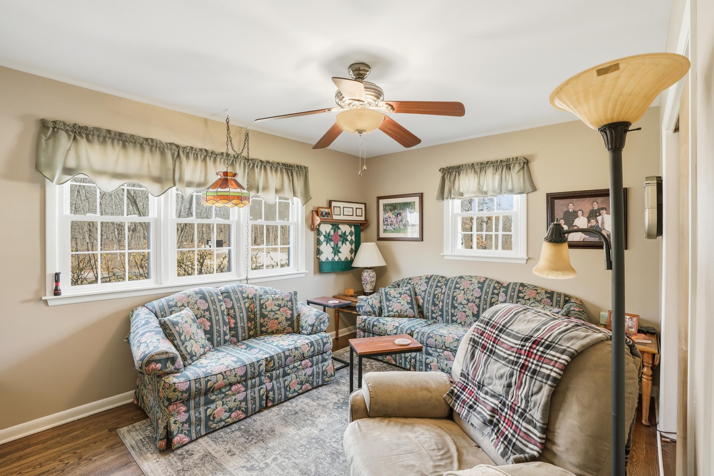 8951 State Line Road Dyer, IN 46311 - Photo 9 of 28 a living room with furniture a ceiling fan and a window