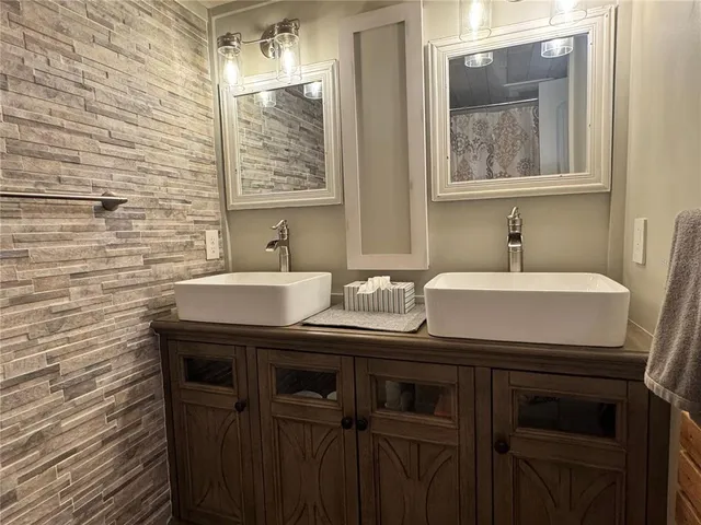 a view of a room with wooden floor and cabinet
