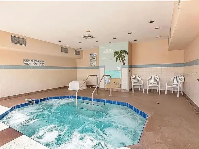a view of a house with swimming pool and a yard