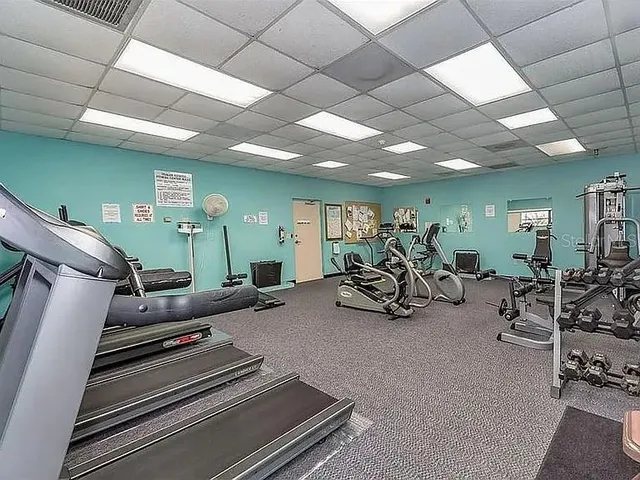 a view of a swimming pool with lounge chair