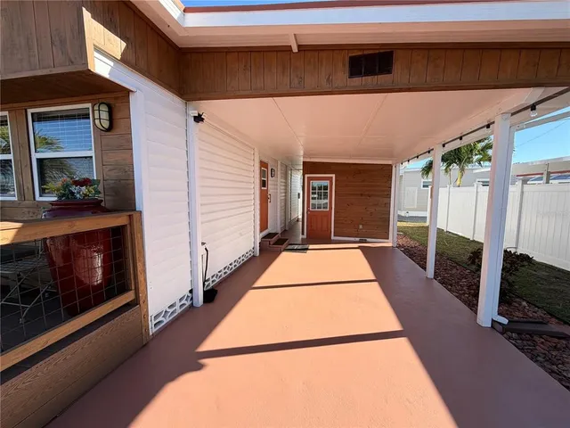 a view of a balcony with furniture and a fireplace