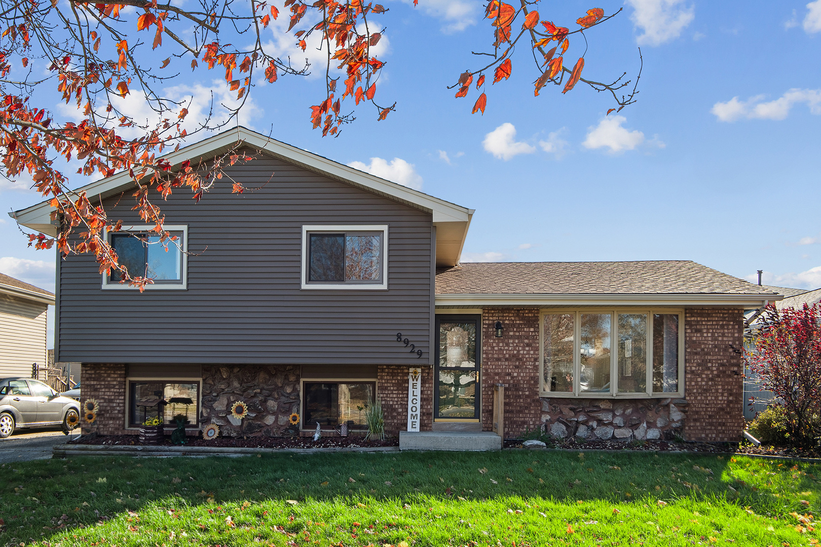 a front view of a house with garden