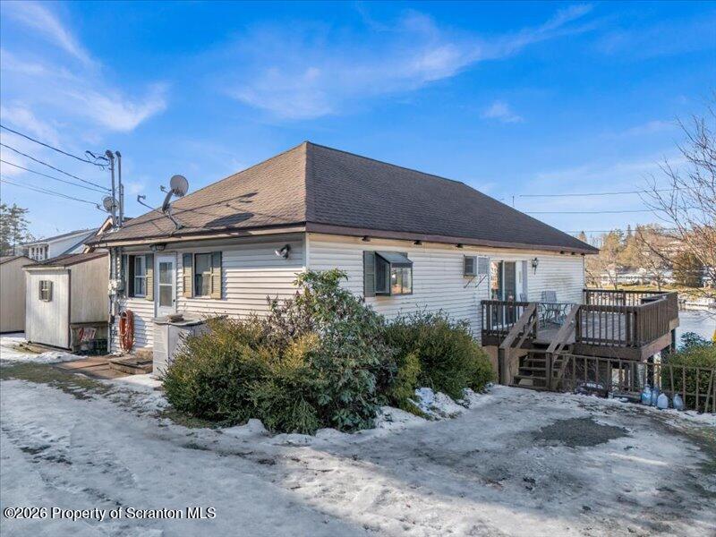 1228 Lake Road Factoryville, PA 18419 - Photo 2 of 43 a front view of a house with garden