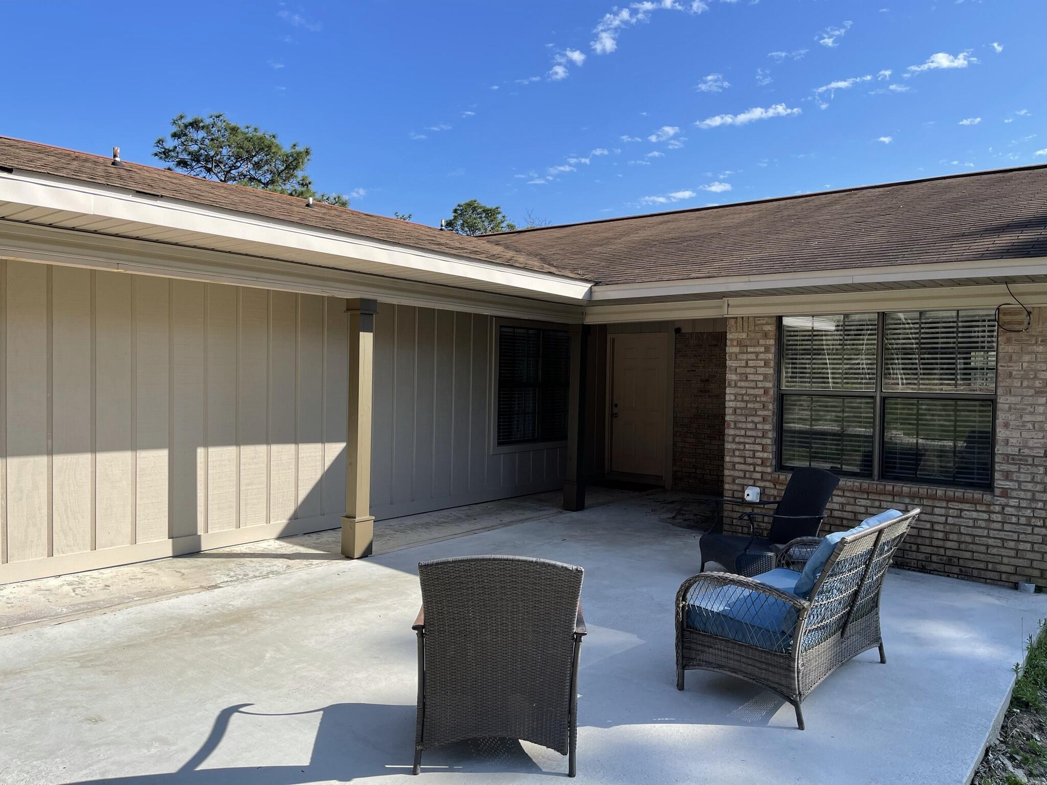 455 Ridge Lake Road Crestview, FL 32536 - Photo 13 of 22 a building outdoor space with patio furniture