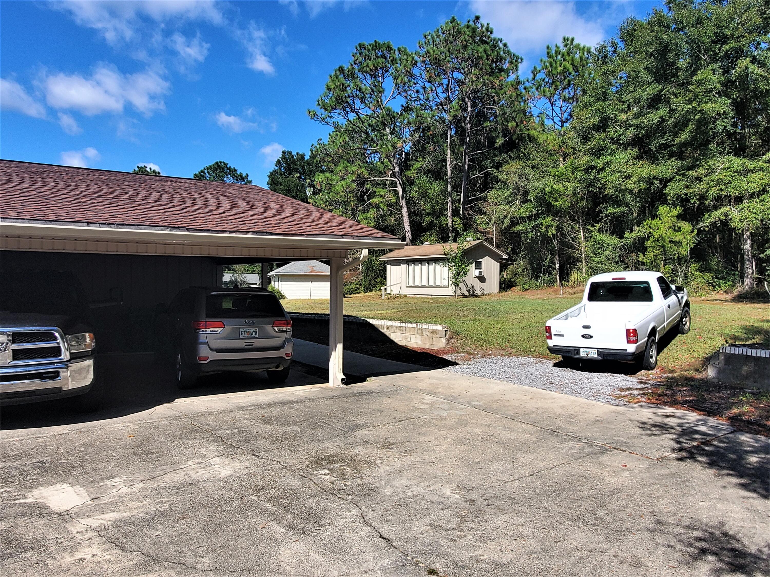 455 Ridge Lake Road Crestview, FL 32536 - Photo 14 of 22 a view of a car parked in front of a house