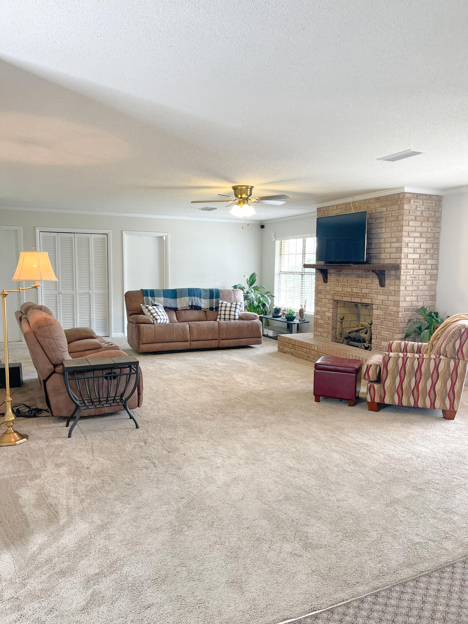 455 Ridge Lake Road Crestview, FL 32536 - Photo 7 of 22 a bedroom with furniture and a flat screen tv