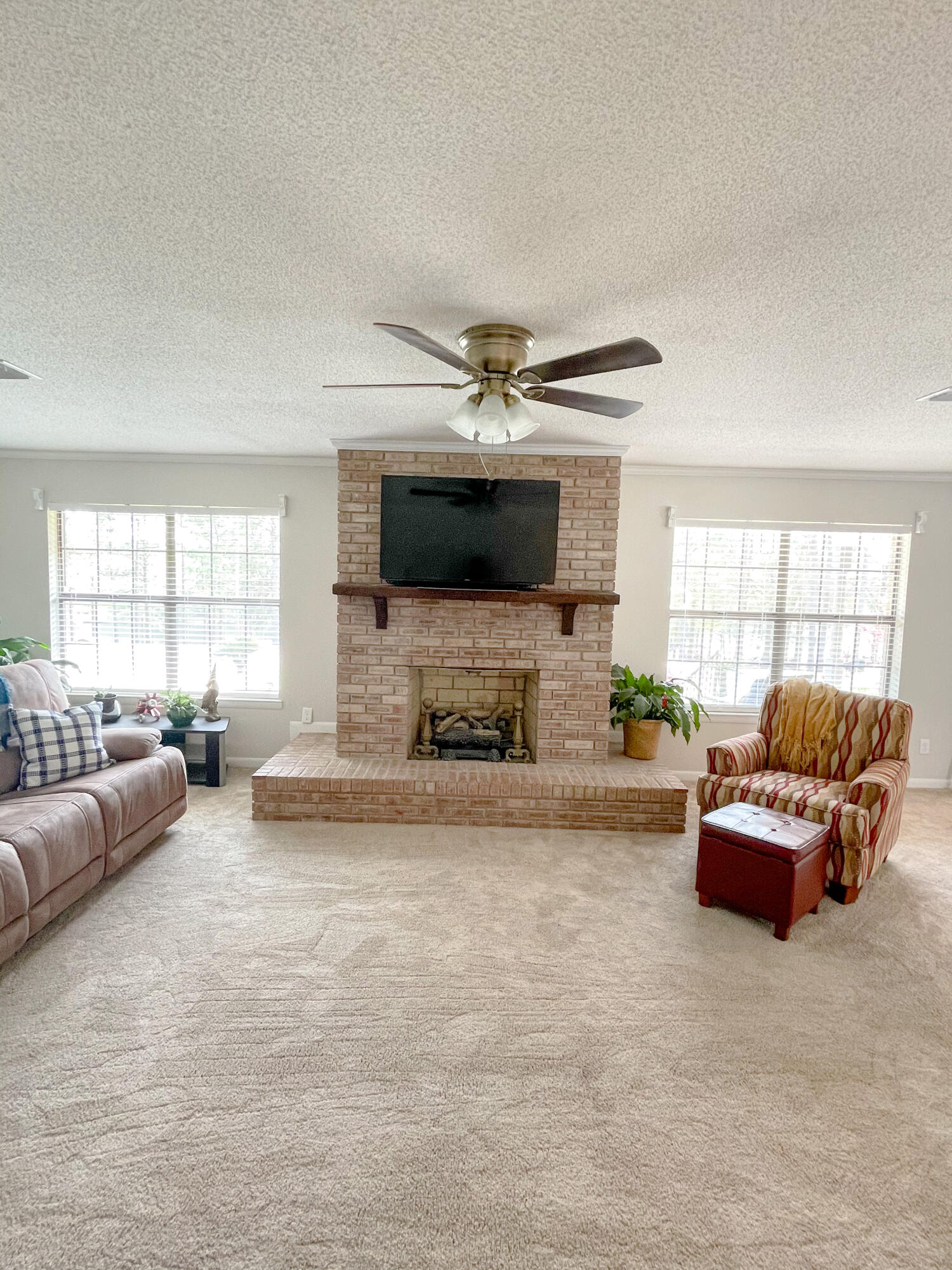 455 Ridge Lake Road Crestview, FL 32536 - Photo 8 of 22 a living room with furniture fireplace and flat screen tv