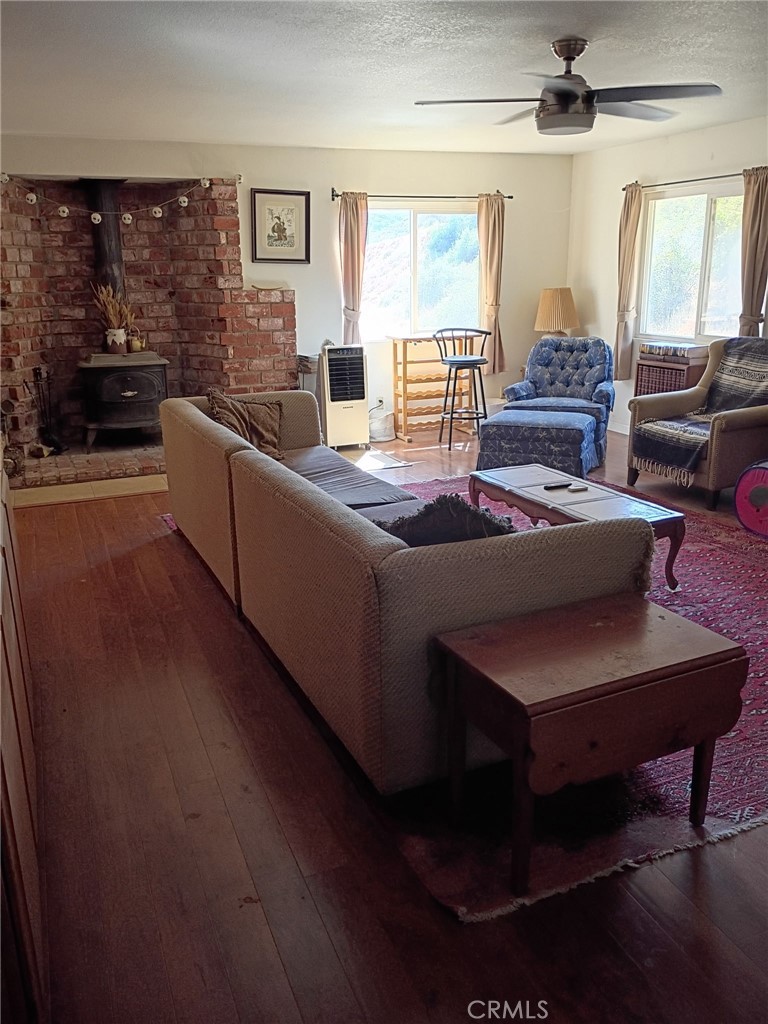 42930 Lake Hughes Road Lake Hughes, CA 93532 - Photo 13 of 54 a living room with furniture and a large window