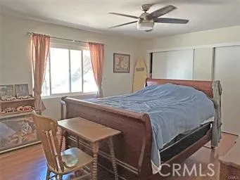 a bedroom with a bed and a table