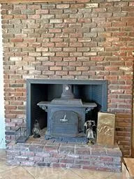 a view of fireplace and wooden floor
