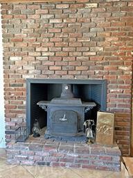 42930 Lake Hughes Road Lake Hughes, CA 93532 - Photo 18 of 54 a view of fireplace and wooden floor
