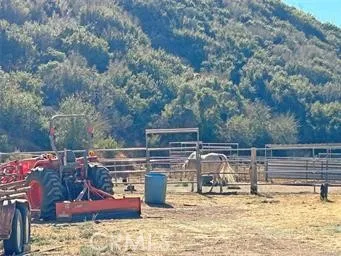 a view of roof deck with a barbeque and wooden stairs