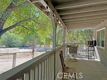 42930 Lake Hughes Road Lake Hughes, CA 93532 - Photo 32 of 54 a view of a balcony with lake view and wooden floor