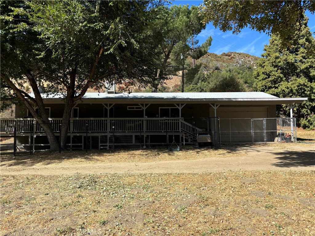42930 Lake Hughes Road Lake Hughes, CA 93532 - Photo 38 of 54 a view of house with a yard