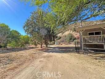 42930 Lake Hughes Road Lake Hughes, CA 93532 - Photo 42 of 54 a view of a yard with wooden fence