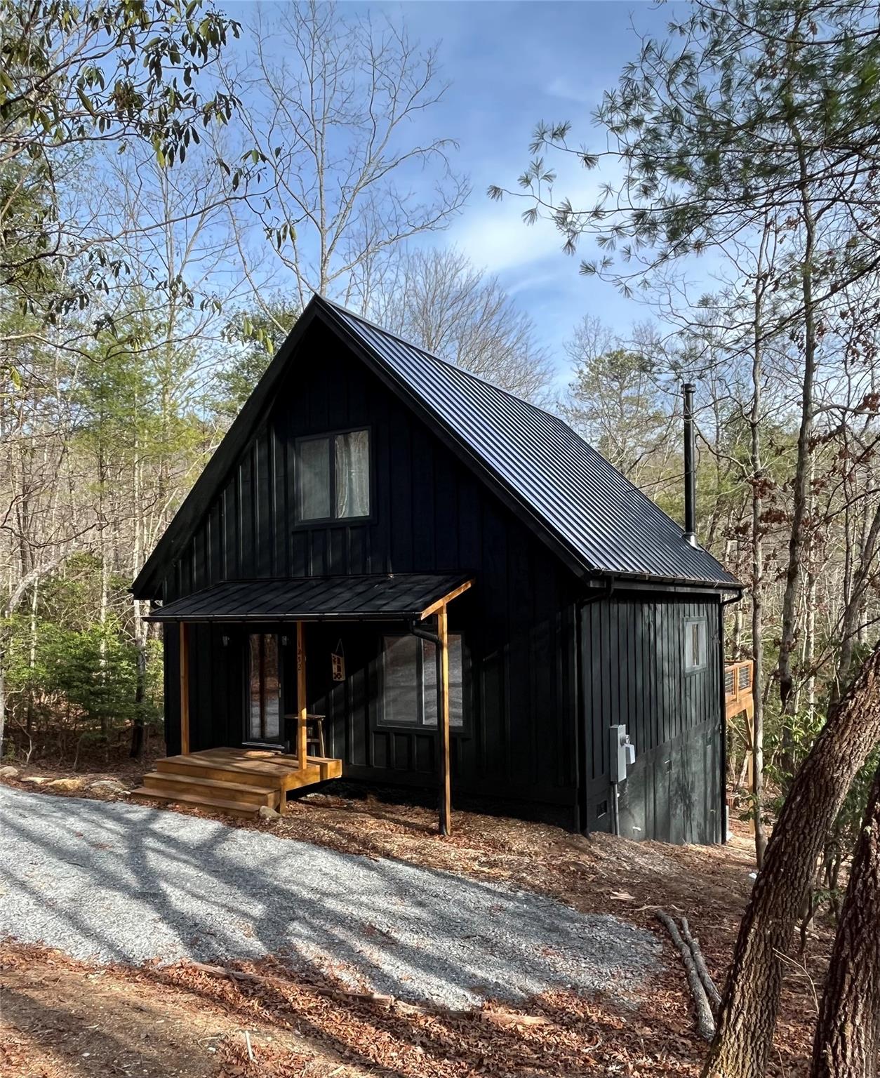 a view of house with backyard space and balcony