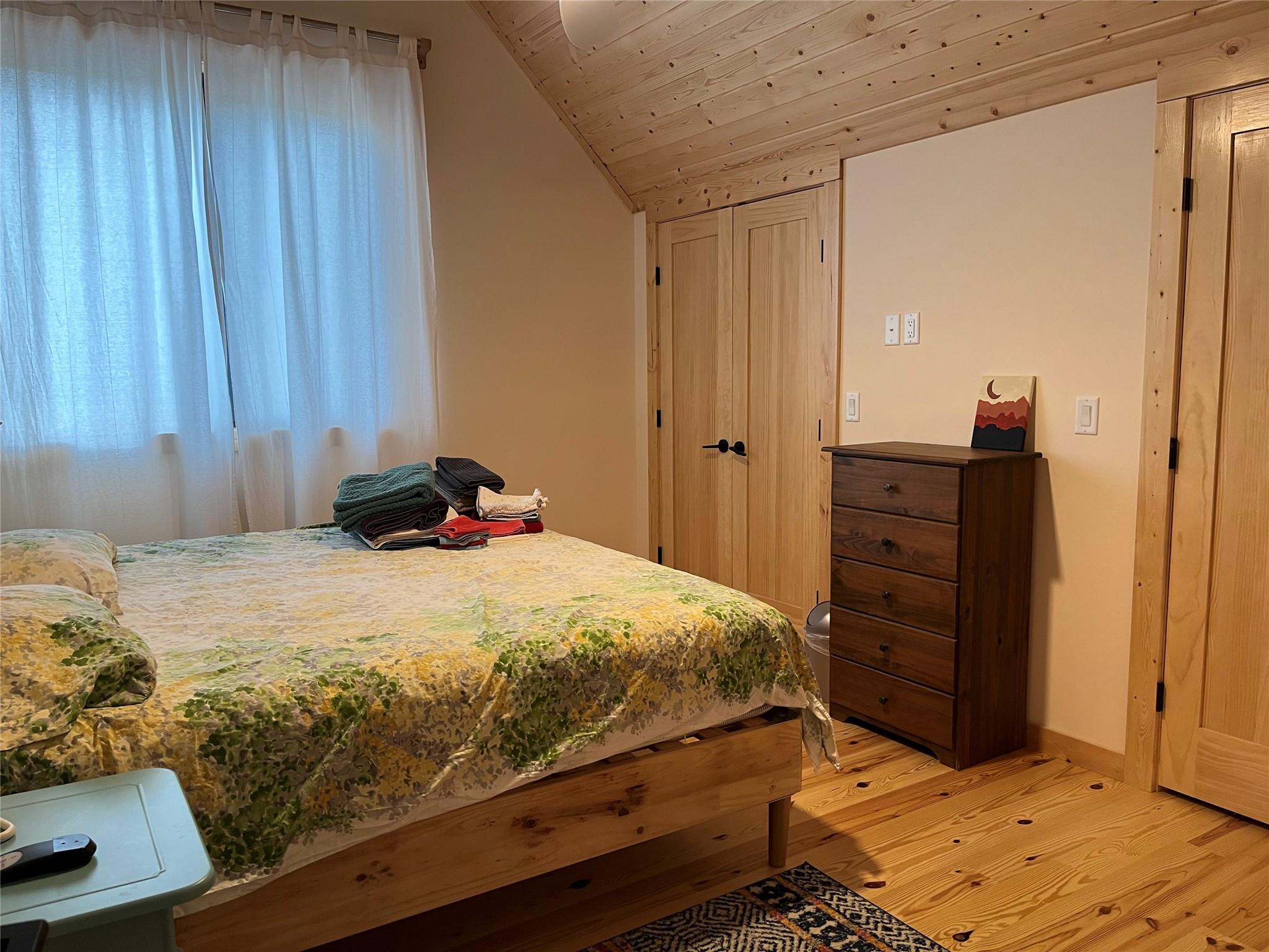 1252 Cardinal Road Brevard, NC 28712 - Photo 14 of 31 a bedroom with a bed and a dresser