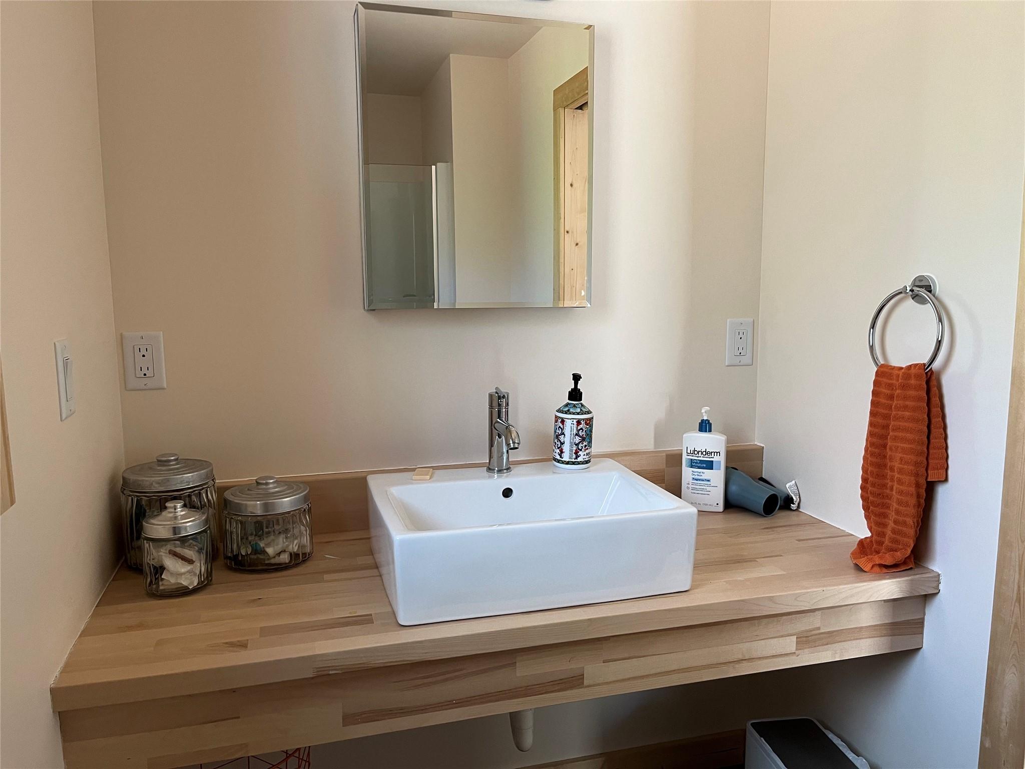1252 Cardinal Road Brevard, NC 28712 - Photo 15 of 31 a bathroom with a sink and a mirror