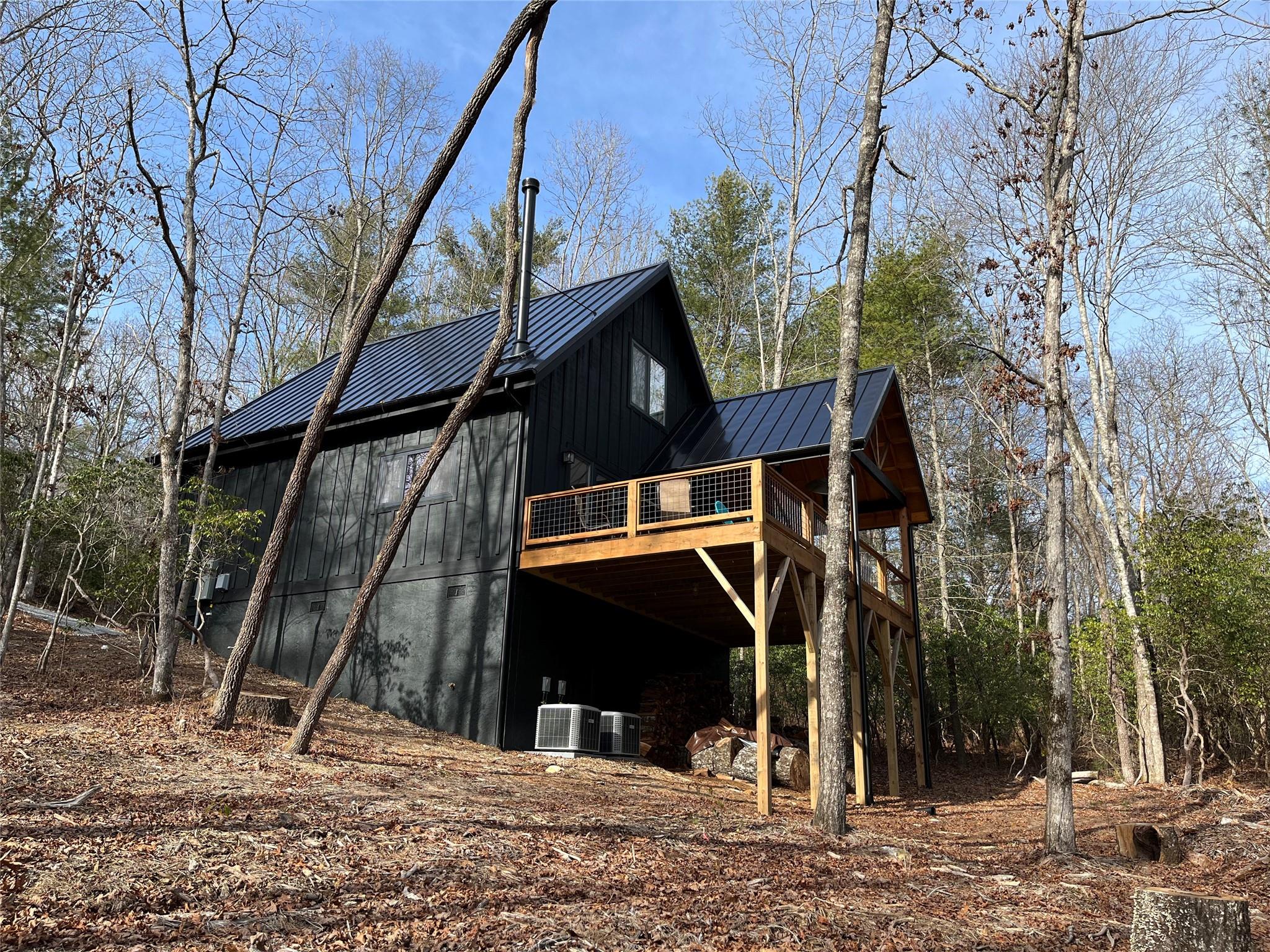 1252 Cardinal Road Brevard, NC 28712 - Photo 21 of 31 a view of a house with a tree