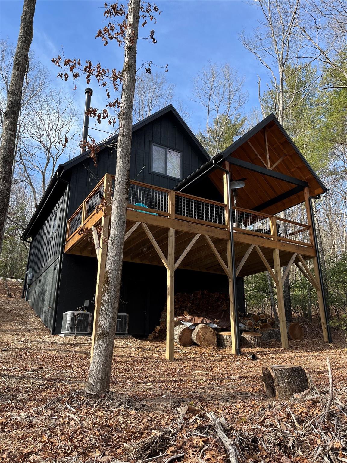 1252 Cardinal Road Brevard, NC 28712 - Photo 22 of 31 a view of a wooden house with a large tree