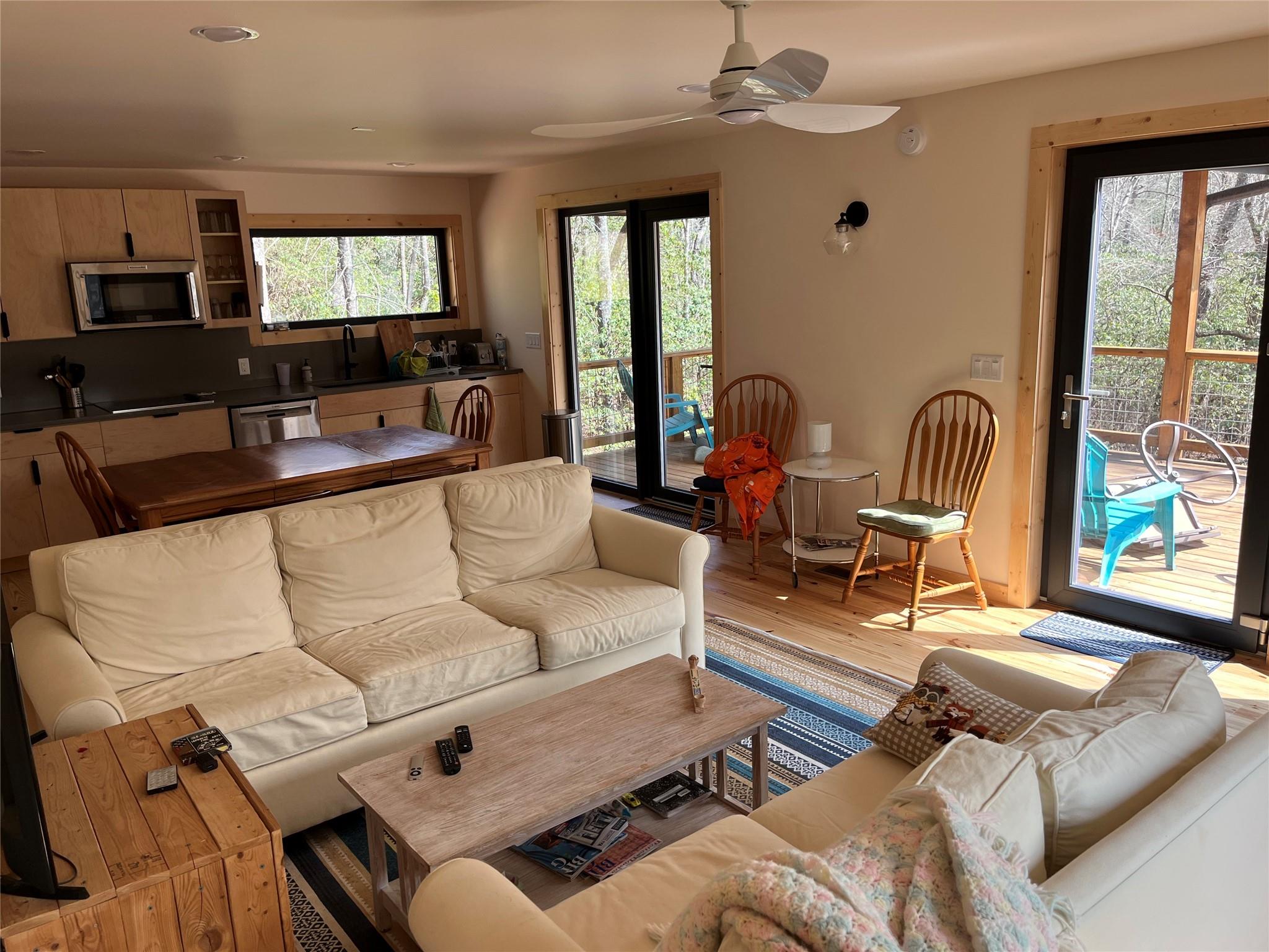 1252 Cardinal Road Brevard, NC 28712 - Photo 3 of 31 a living room with furniture or couch and a flat screen tv