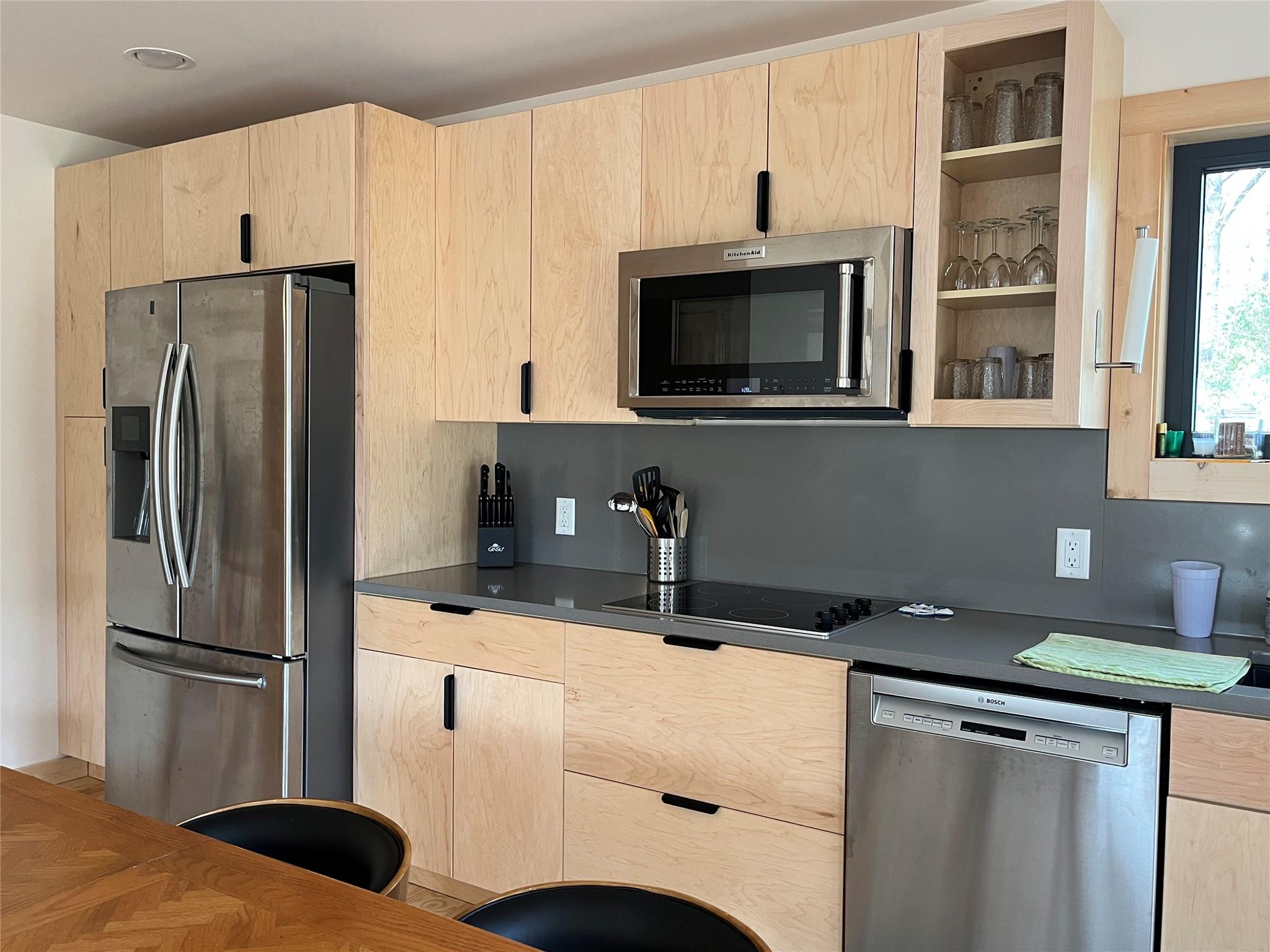 1252 Cardinal Road Brevard, NC 28712 - Photo 6 of 31 a kitchen with a refrigerator and a sink