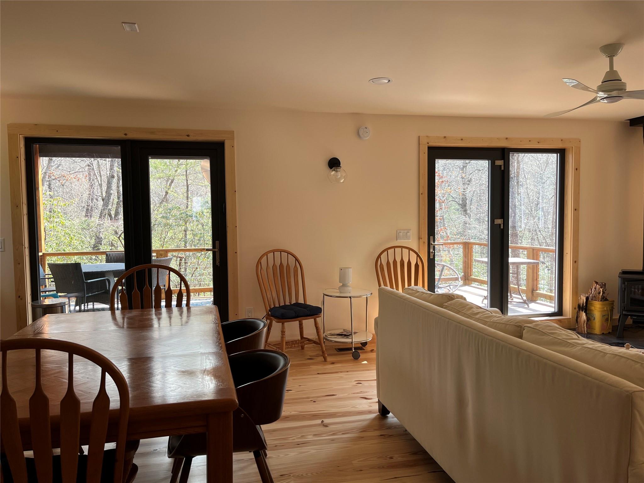 1252 Cardinal Road Brevard, NC 28712 - Photo 8 of 31 a view of a dining room with furniture window and outside view
