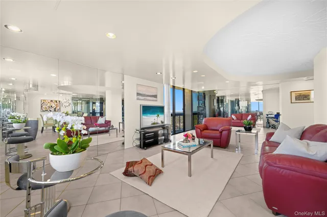 a living room with furniture fireplace and a window