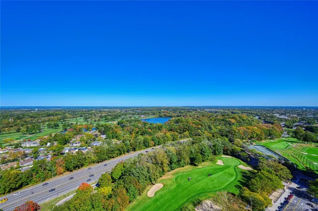 a dining room with furniture and chandelier