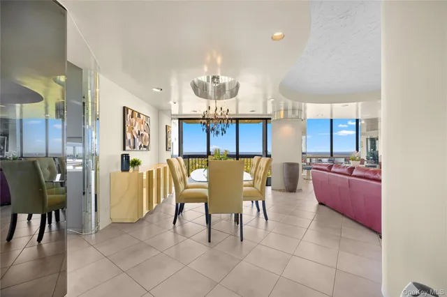 a dining room with furniture and window