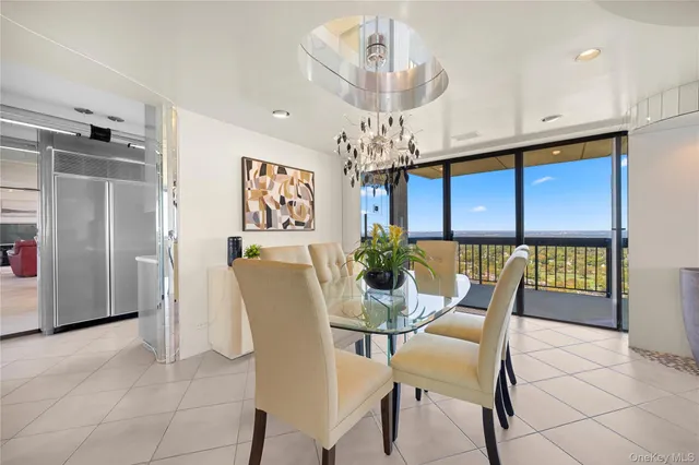a kitchen with a sink stainless steel appliances a counter top space and cabinets