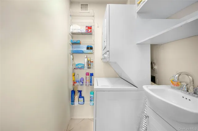 a living room with furniture a window and a flat screen tv