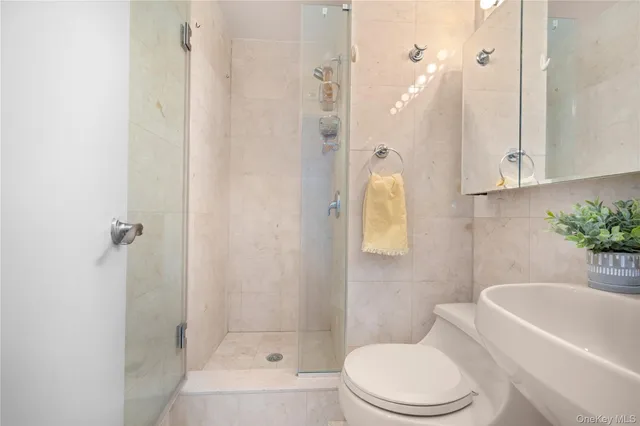 a bedroom with double bed and a couch