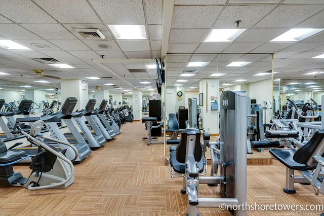 a room with pool table and wooden floor