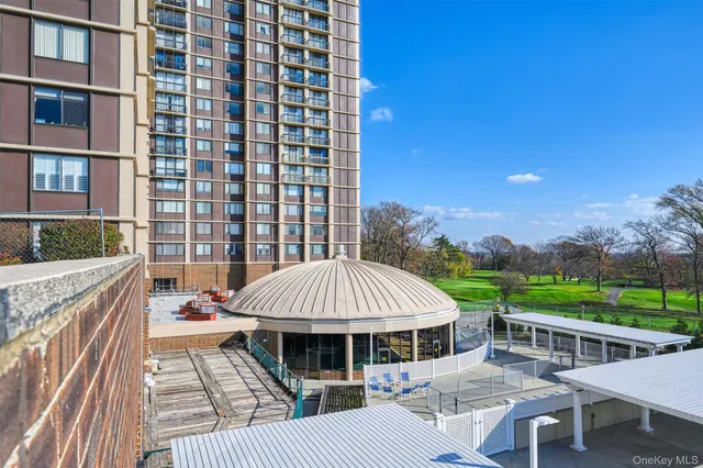 a view of a swimming pool with a patio