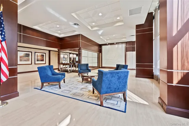 a lobby with a couch and a rug