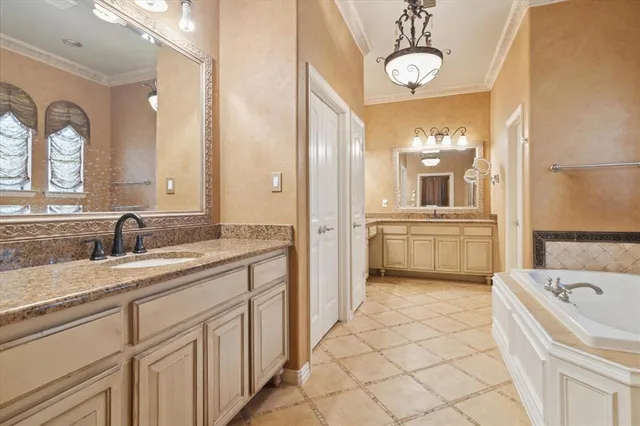 a spacious bathroom with a sink a mirror and bathtub