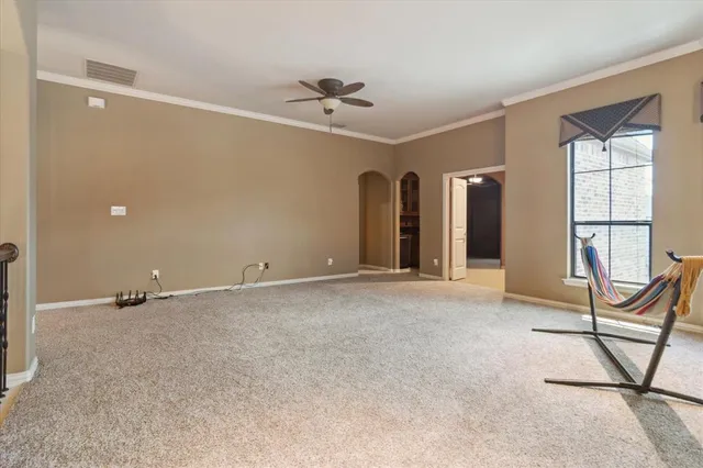 a view of an empty room with a window