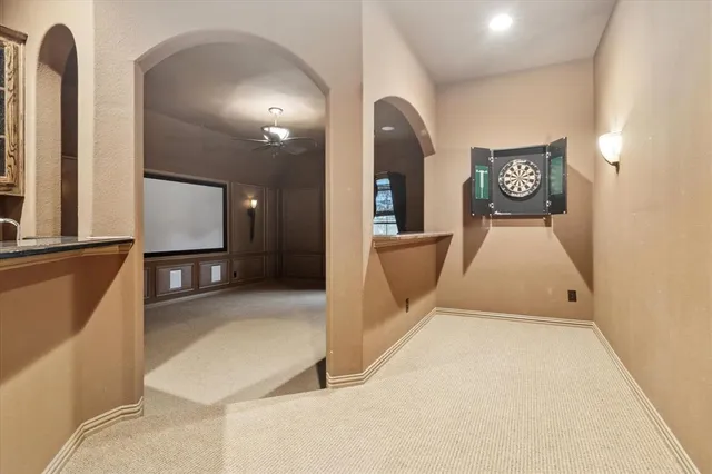 a view of a hallway with entryway wooden floor and front door