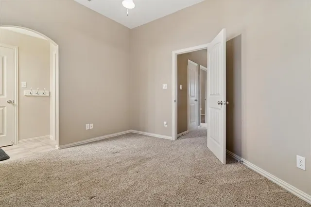 a bathroom with a sink a toilet a mirror and shower curtain